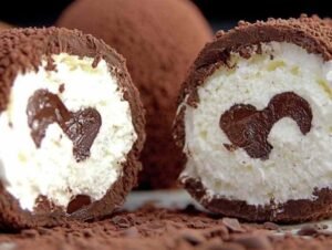 Boules meringuées au chocolat Alunga décorées de pailletés fins