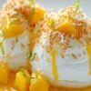 Boule meringuée exotique garnie de noix de coco et zestes de citron vert