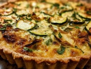 tarte courgette comté dorée sortant du four